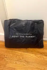 A unopened package form Rent the Runway