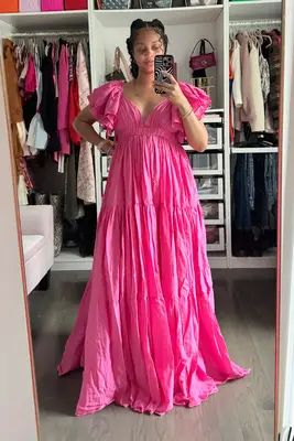 A woman wearing the Erika Pena Vale Maxi Dress from Nuuly