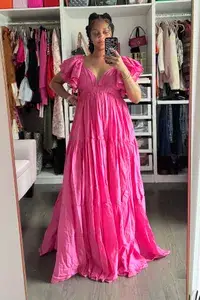 A woman wearing the Erika Pena Vale Maxi Dress from Nuuly