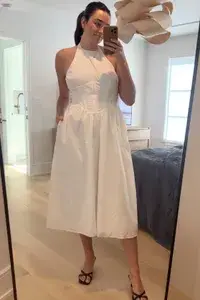 A woman wearing the Bardot Kylen Poplin Midi Dress from fashionpass