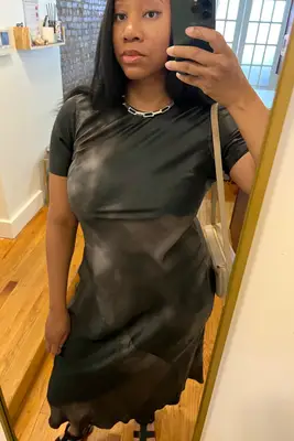 A woman wearing the Silk Laundry Bias Dress from Rent the Runway