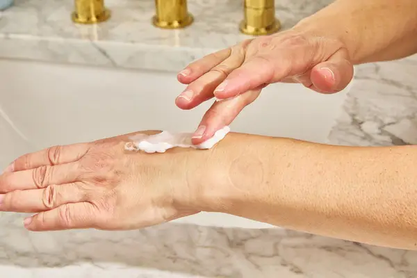 eos Shea Better 24H Moisture Body Lotion on back of hand