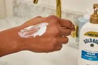 Gold Bond Healing Hydrating Lotion on back of hand