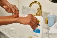 Gold Bond Healing Hydrating Lotion on back of hand