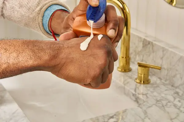 Vaseline Intensive Care Cocoa Radiant Smoothing Body Butter on back of hand