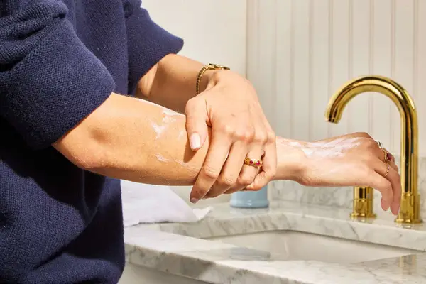 Vanicream Moisturizing Skin Cream being rubbed into arms