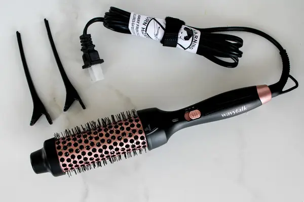 product shot of the Wavy Talk brush and the clips that come with it