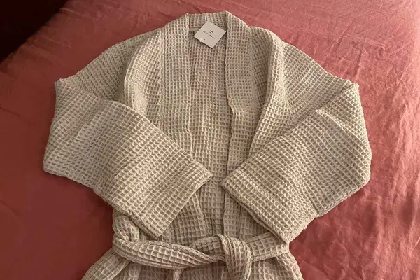 Parachute Waffle Robe displayed on an orange blanket