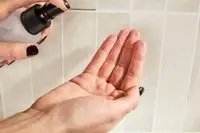 Close-up of Kate Somerville ExfoliKate Intensive Exfoliating Treatment dollop on back of hand