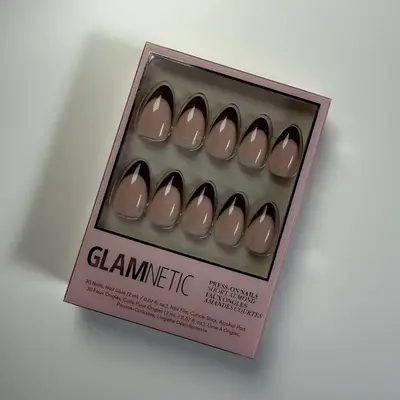 Close-up of package of Glamnetic press-on nails with colorful French tip