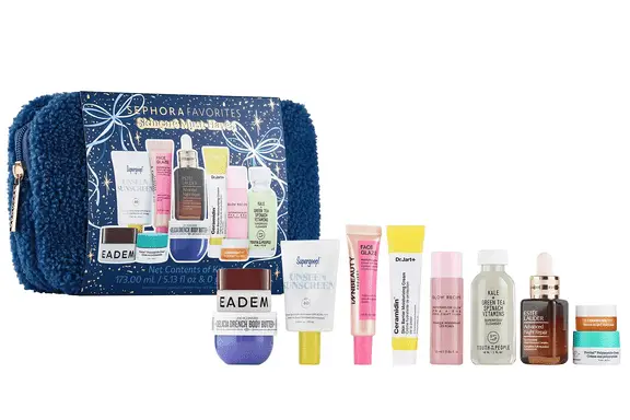 Navy blue fuzzy makeup bag with ten mini skincare products