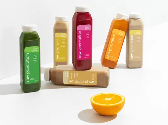 Three varieties of juice bottles displayed, each with distinct designs and branding