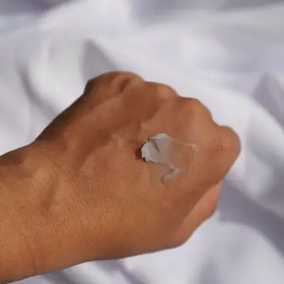 Milani Cosmetics Conceal + Perfect Blur Out Smoothing Primer texture on hand