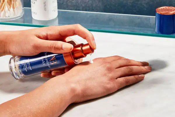 Model testing augustinus bader cream on hand