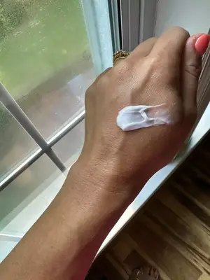 CeraVe Moisturizing Cream for Normal to Dry Skin with Ceramides on the back of a person