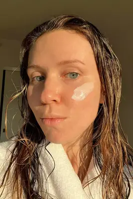 A person applying Rhode Beauty Barrier Restore Cream to their face next to a person using their finger to apply La Roche-Posay Matte Toleriane Double Repair Moisturizer to their cheek