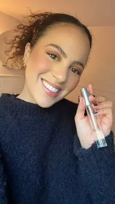 MYM Beauty editor holding Maison Louis Marie No 04 perfume 