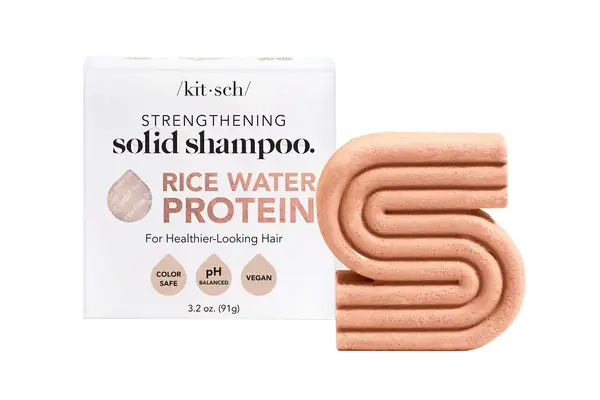 a person lathering Miriam Quevedo Black Baccara Hair Multiplying Shampoo in their hands