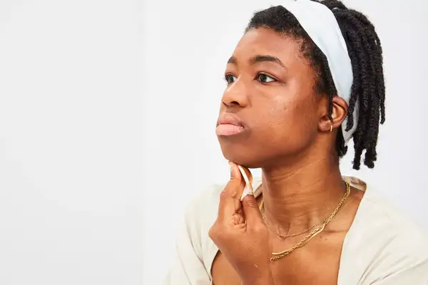 Photos of person’s face before and after using Almay Make Myself Clear Clear Complexion Makeup